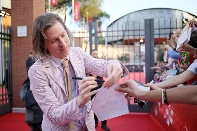 ROME, ITALY - OCTOBER 19: Wes Anderson signs autographs on a red carpet during the 14th Rome Film Fe...