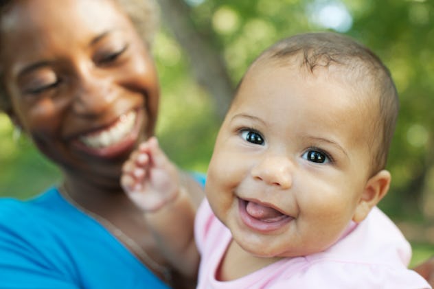cute baby girl smiling with her mom