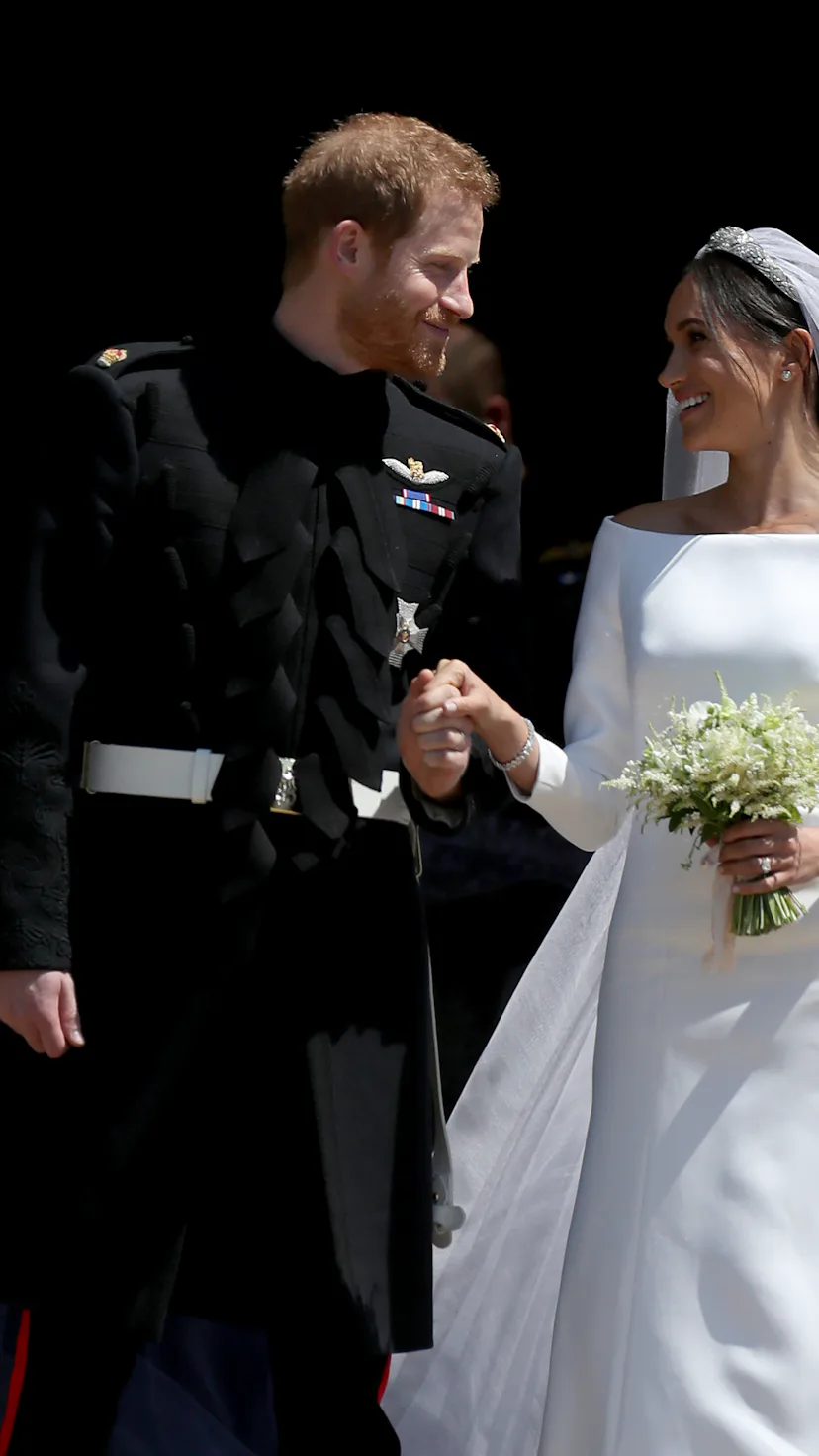 Prince Harry and Meghan Markle leave St George's Chapel in Windsor Castle after their wedding. (Phot...