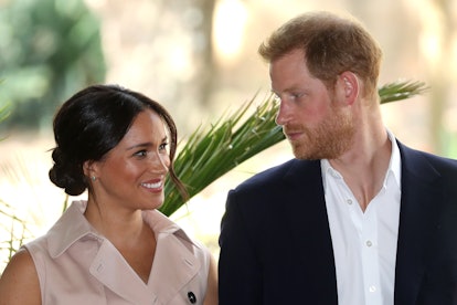 Prince Harry, Duke of Sussex and Meghan, Duchess of Sussex communicate through a smile and a glance