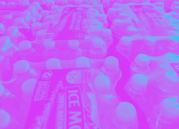 Cases of water are distributed to Flint area residents at Asbury United Methodist Help Center in Fli...