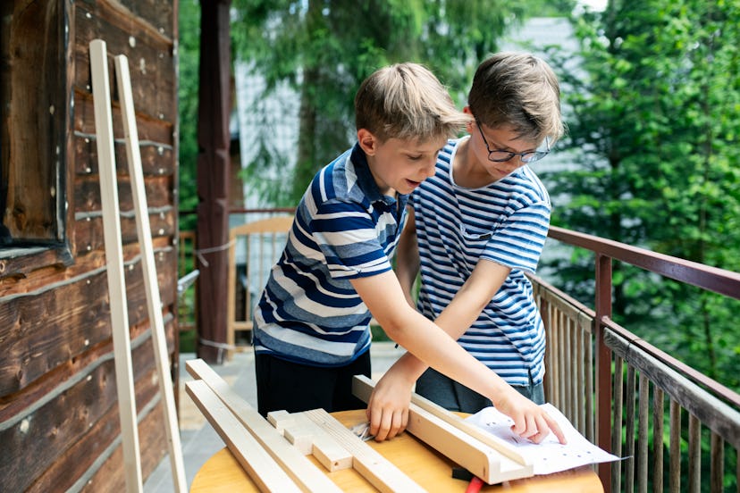 Little boys are building an easel from wood pieces; Instagram captions for national brother's day