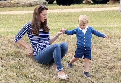 Prince George helps his mom.