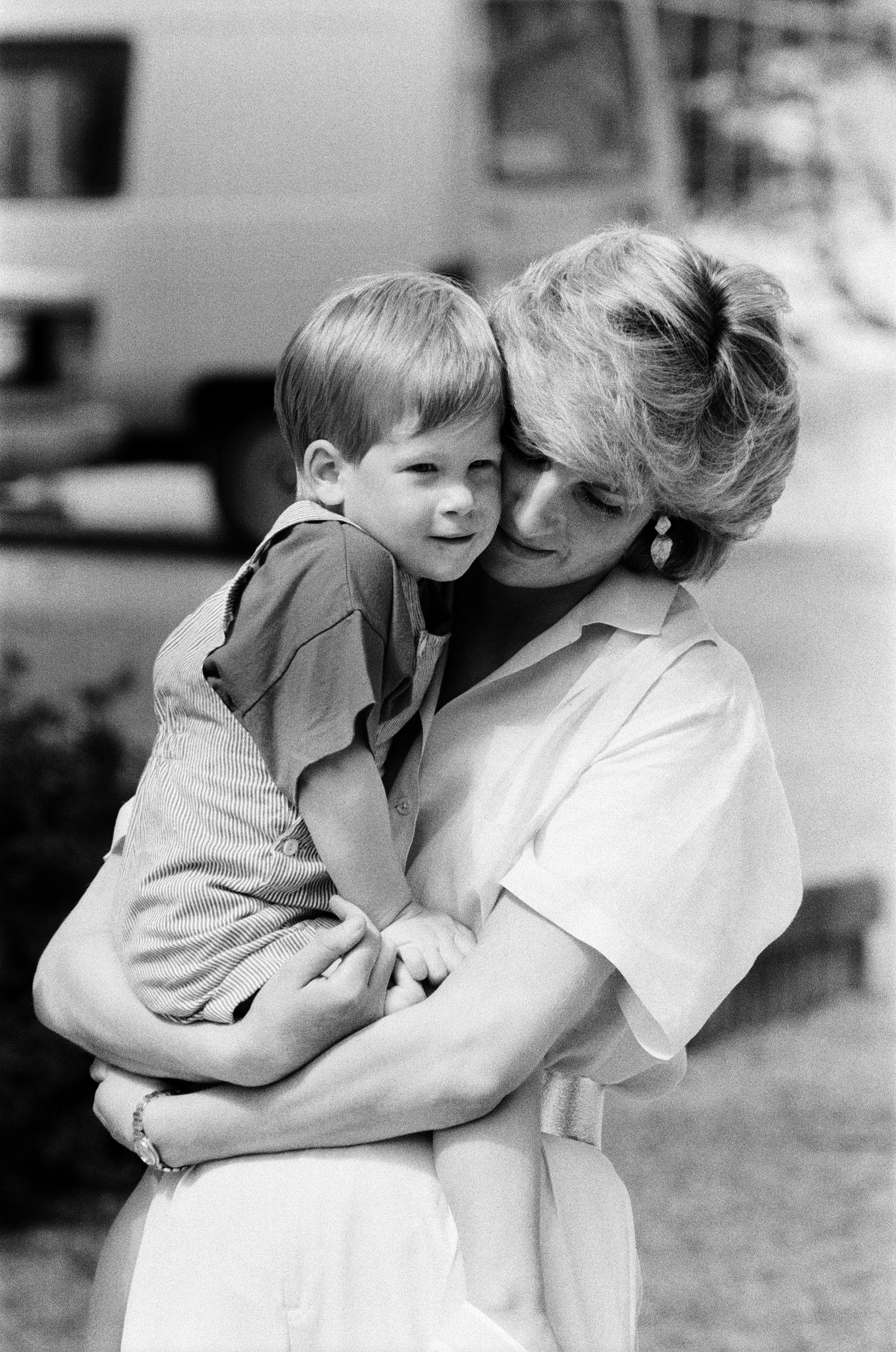 HRH Princess Diana, The Princess of Wales holds her young son Prince Harry on holiday in Majorca, Sp...