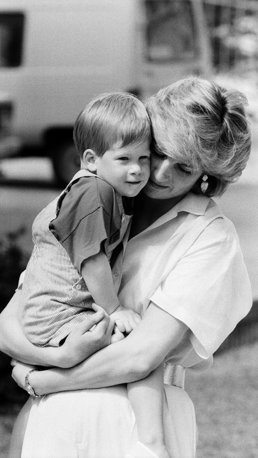 HRH Princess Diana, The Princess of Wales holds her young son Prince Harry on holiday in Majorca, Sp...