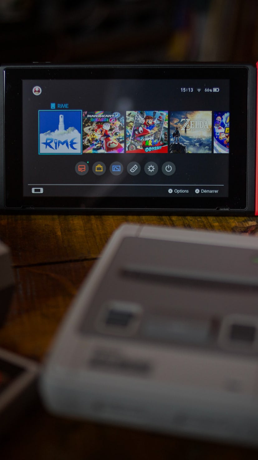 BANGKOK, THAILAND - 2019/01/08: In this photo illustration, a Nintendo Switch (M) surrounded by a N...