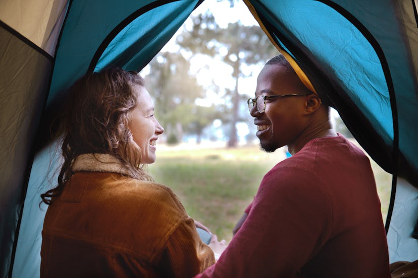 A couple in a tent. Experts explain how long it takes to love someone, depending on different factor...