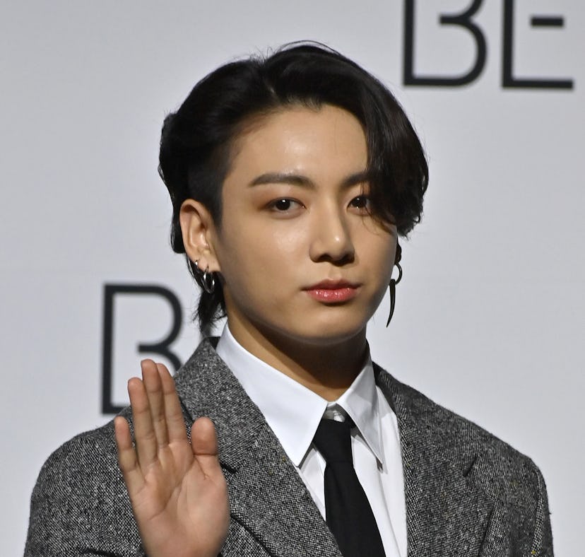 South Korean K-pop boy band BTS member Jung Kook poses for a photo session during a press conference...