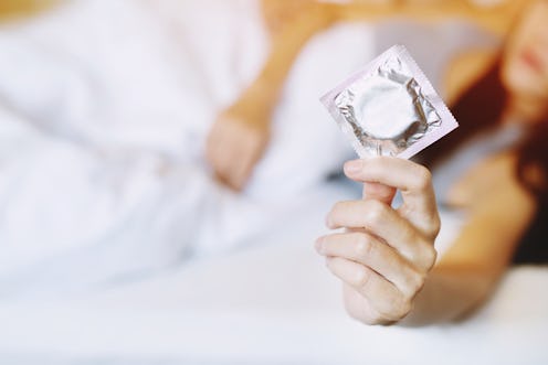 Here's what to do if your partner can't stay hard with condoms.