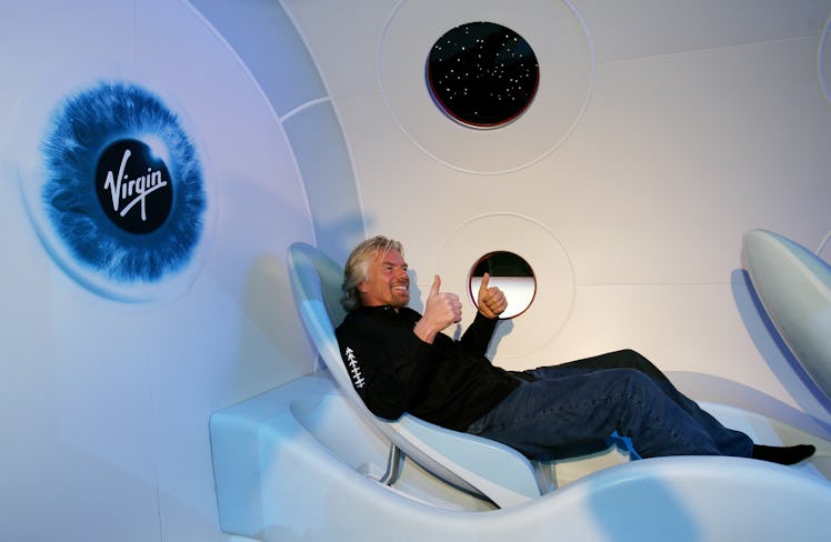 Sir Richard Branson gives a thumbs up from a seat during the unveiling of a scale model of Virgin Ga...