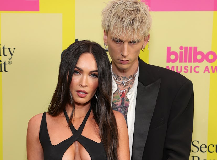 LOS ANGELES, CALIFORNIA - MAY 23: Machine Gun Kelly and Meghan Fox poses backstage for the 2021 Bill...