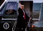 President Donald Trump gives a final wave as he boards Marine One as he and First Lady Melania Trump...
