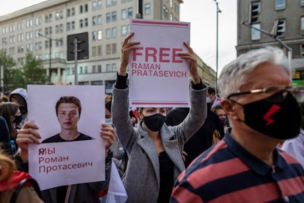 Belarusians living in Poland and Poles supporting them hold up a placard reading 'Free Roman Protase...