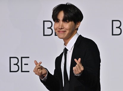 South Korean K-pop boy band BTS member J-Hope poses for a photo session during a press conference on...