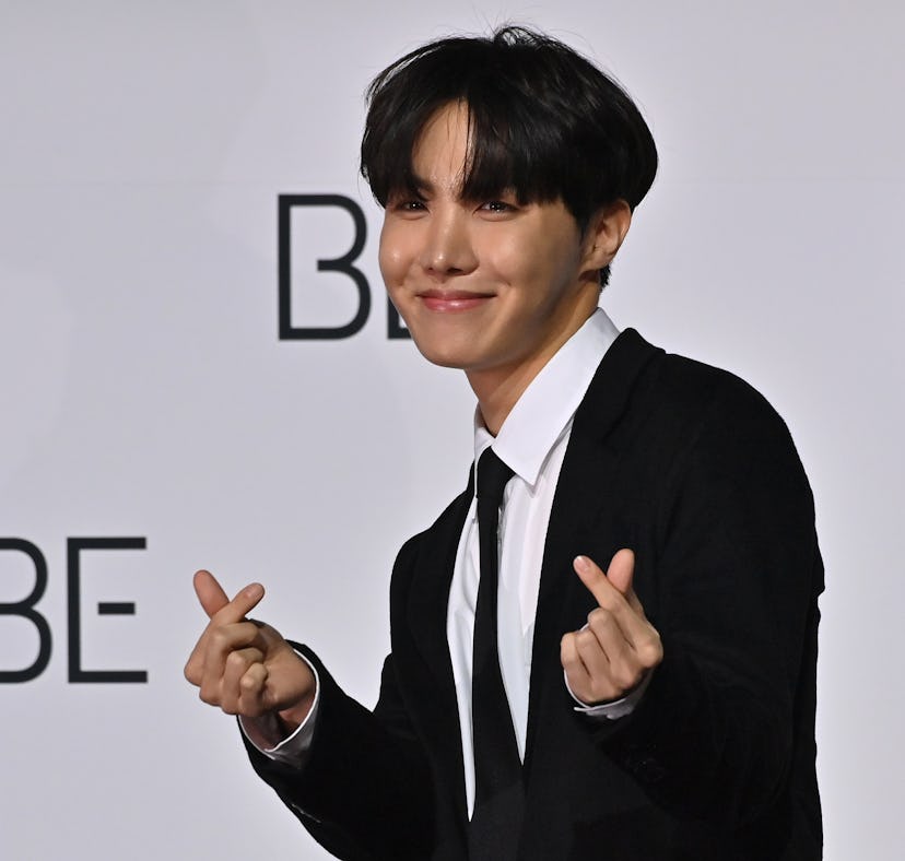 South Korean K-pop boy band BTS member J-Hope poses for a photo session during a press conference on...