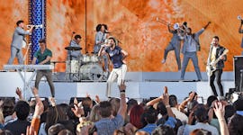 Ryan Met, Jack Met, and Adam Brett Met of AJR performing for a packed audience at the 2021 BBMAs