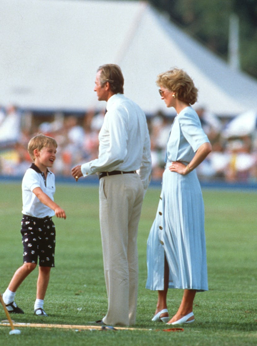 Prince William, Geoffrey Kent and Diana, Princess of Wales, wearing a pale green dress with a pleate...