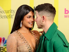 Nick Jonas and Priyanka Chopra shared a sweet kiss on the 2021 BBMAs red carpet.