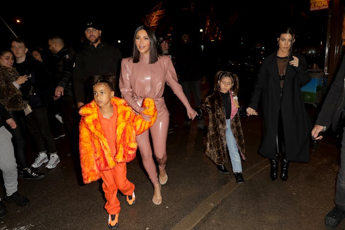 PARIS, FRANCE - MARCH 01: Kim Kardashian, North West ,Penelope Disick and Kourtney Kardashian are se...