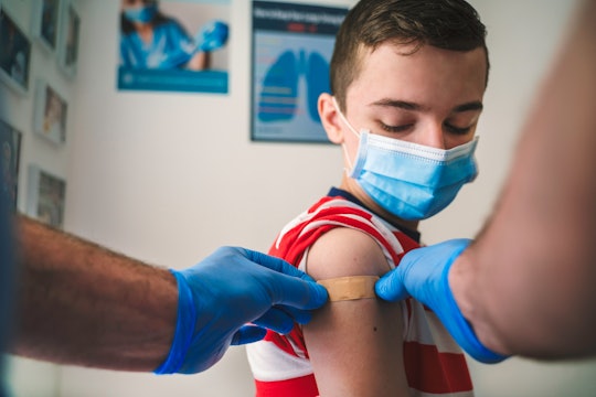 Patient Getting Vaccinated against COVID-19. Child, teenage boy vaccination. Coronavirus epidemic. C...