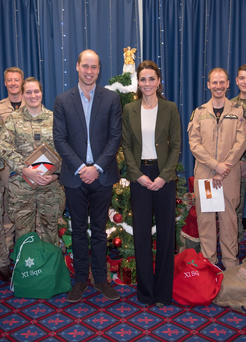 Prince William says his wife was camouflaged by a Christmas tree.