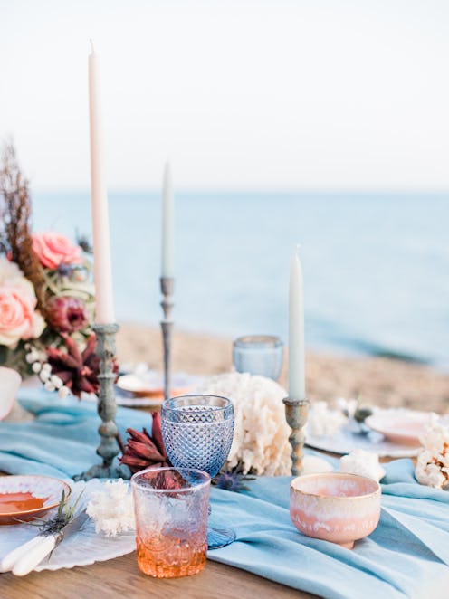 Tablescape for a beach wedding in Santorini with coral and blue details