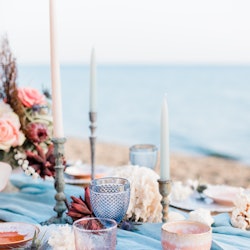 Tablescape for a beach wedding in Santorini with coral and blue details