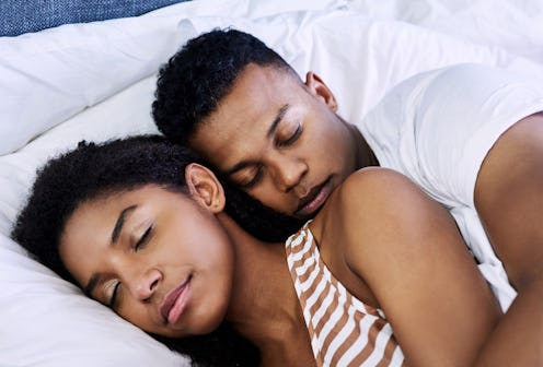 Experts explain what it actually means when you dream about your partner cheating on you.