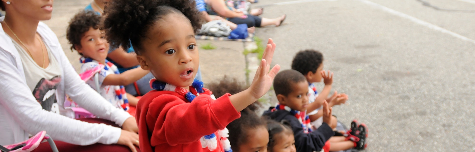 Gizelle Newman, 2, of Pottstown waves to parade participants.Pottstown celebrates the Fourth of July...