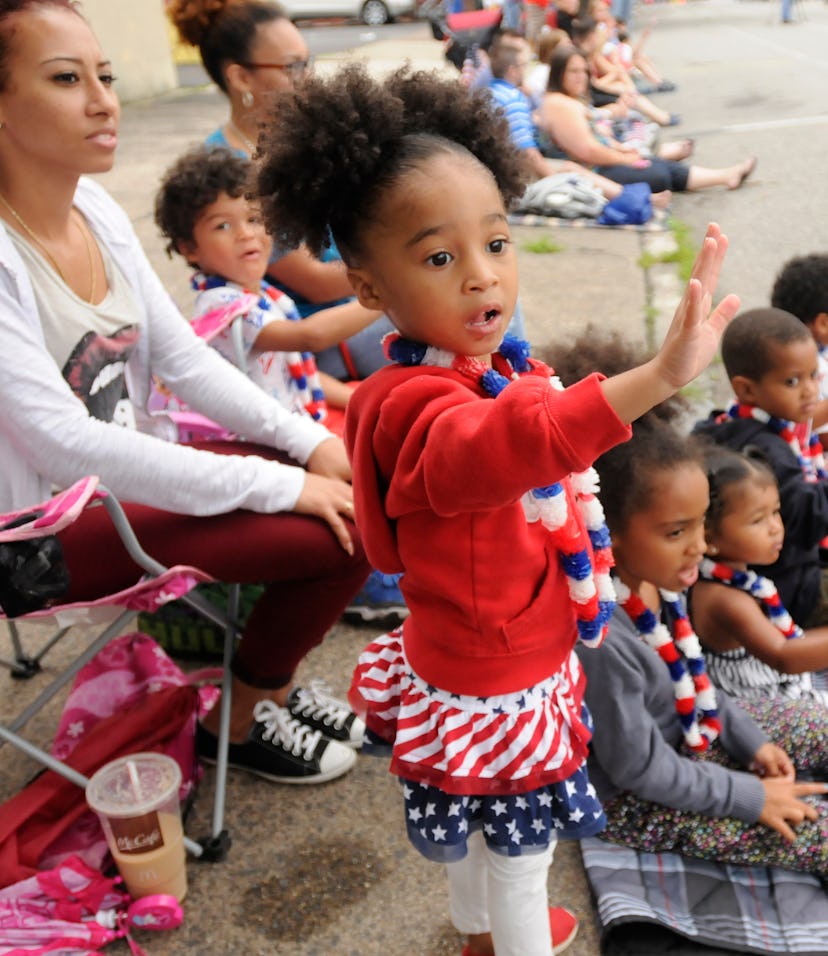 Gizelle Newman, 2, of Pottstown waves to parade participants.Pottstown celebrates the Fourth of July...