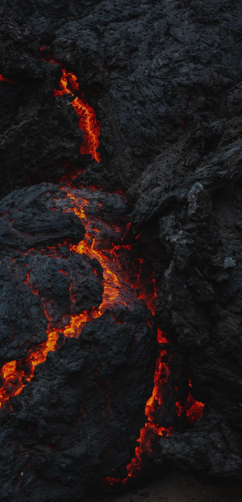 The smoldering lava from the Mount Nyiragongo eruption is seen in Goma on May 23, 2021. - A river of...