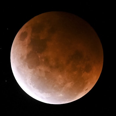 SYDNEY, AUSTRALIA - MAY 26: The full moon, known as a âsuper flower blood moonâ, is seen during its ...