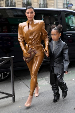 PARIS, FRANCE - MARCH 01: Kim Kardashian and her daughter North West arrive at Theatre des Bouffes d...