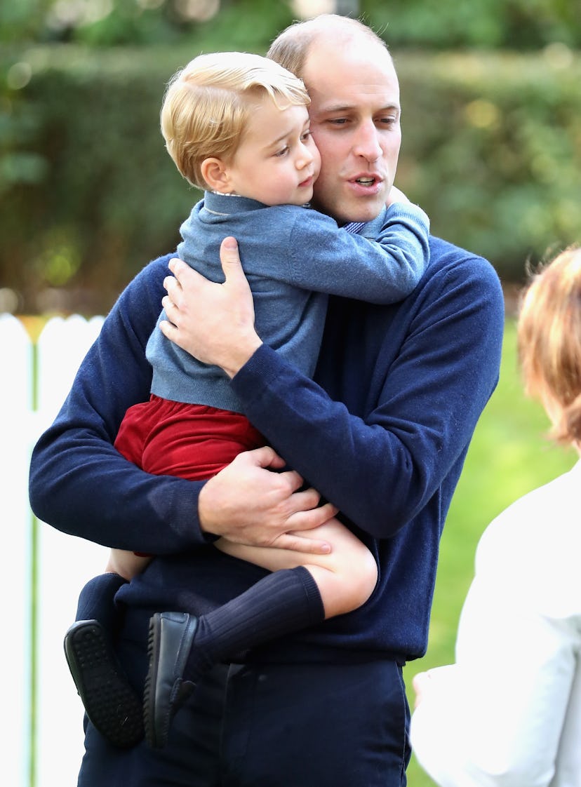 Prince George hugs his dad.