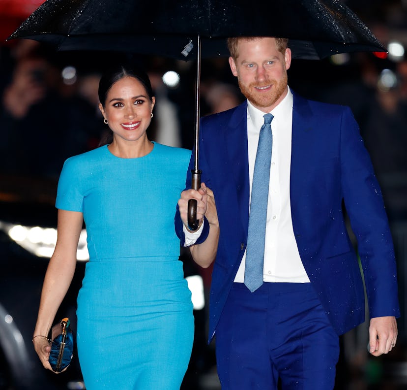 Meghan Markle and Prince Harry wear blue.