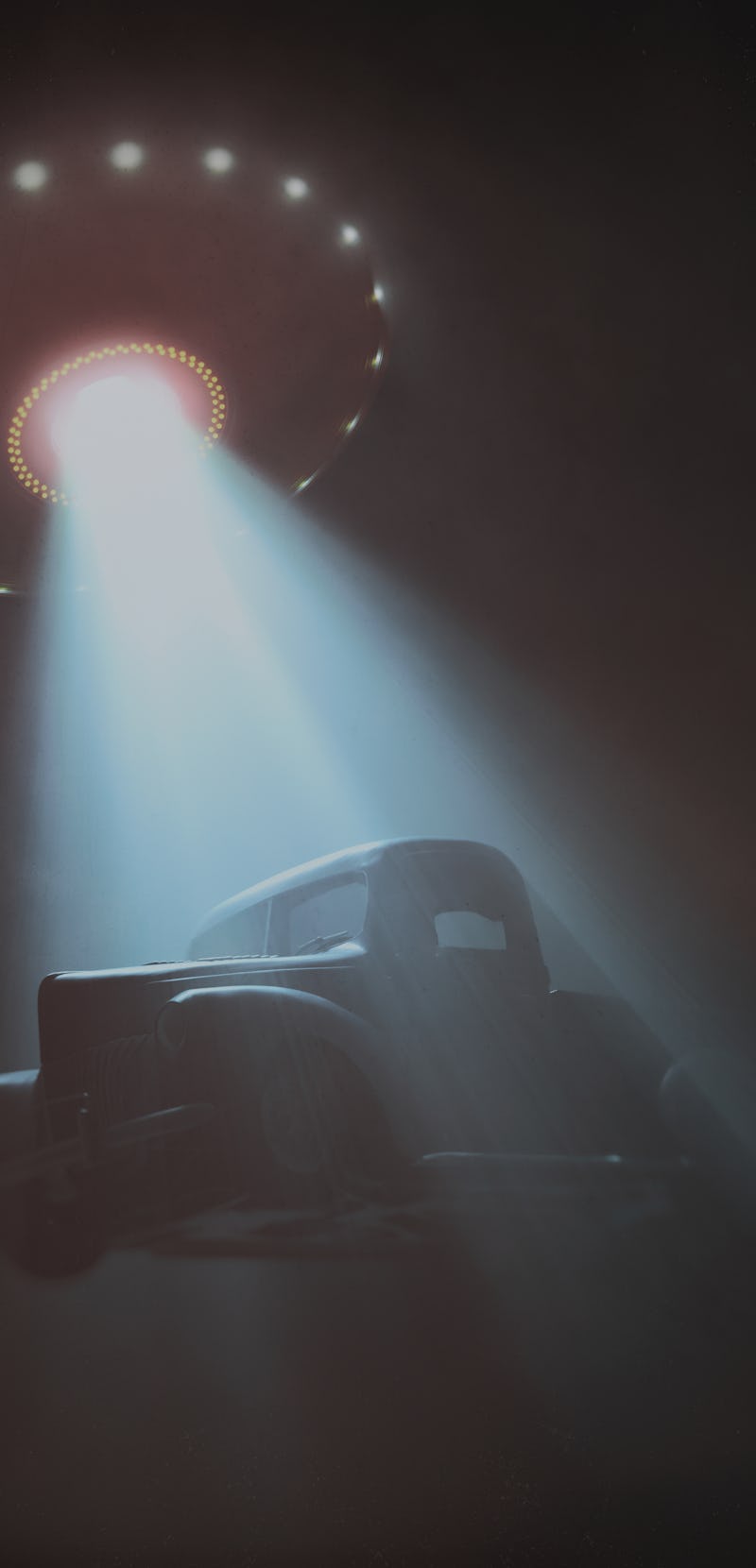 Conceptual illustration of alien abduction. Unidentified flying object (UFO) lifting a car.