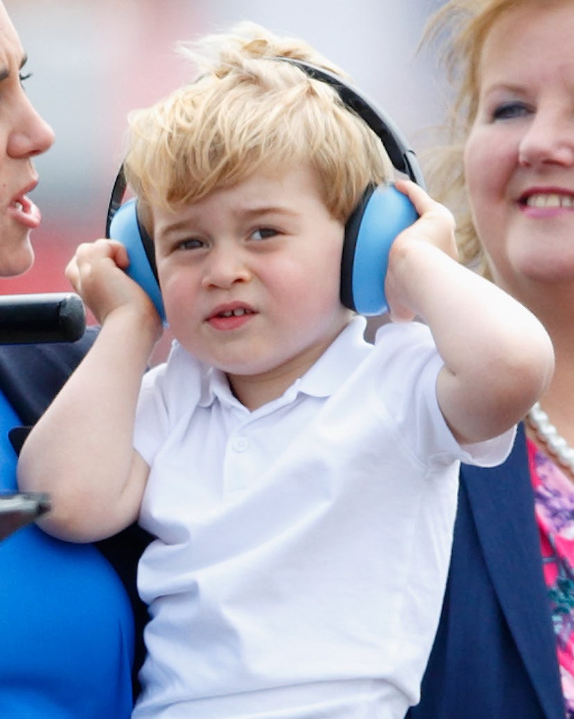 Prince George protects his little ears in 2016.