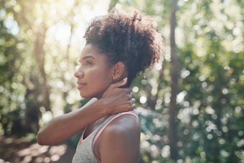 Shot of an attractive young woman stretching her body