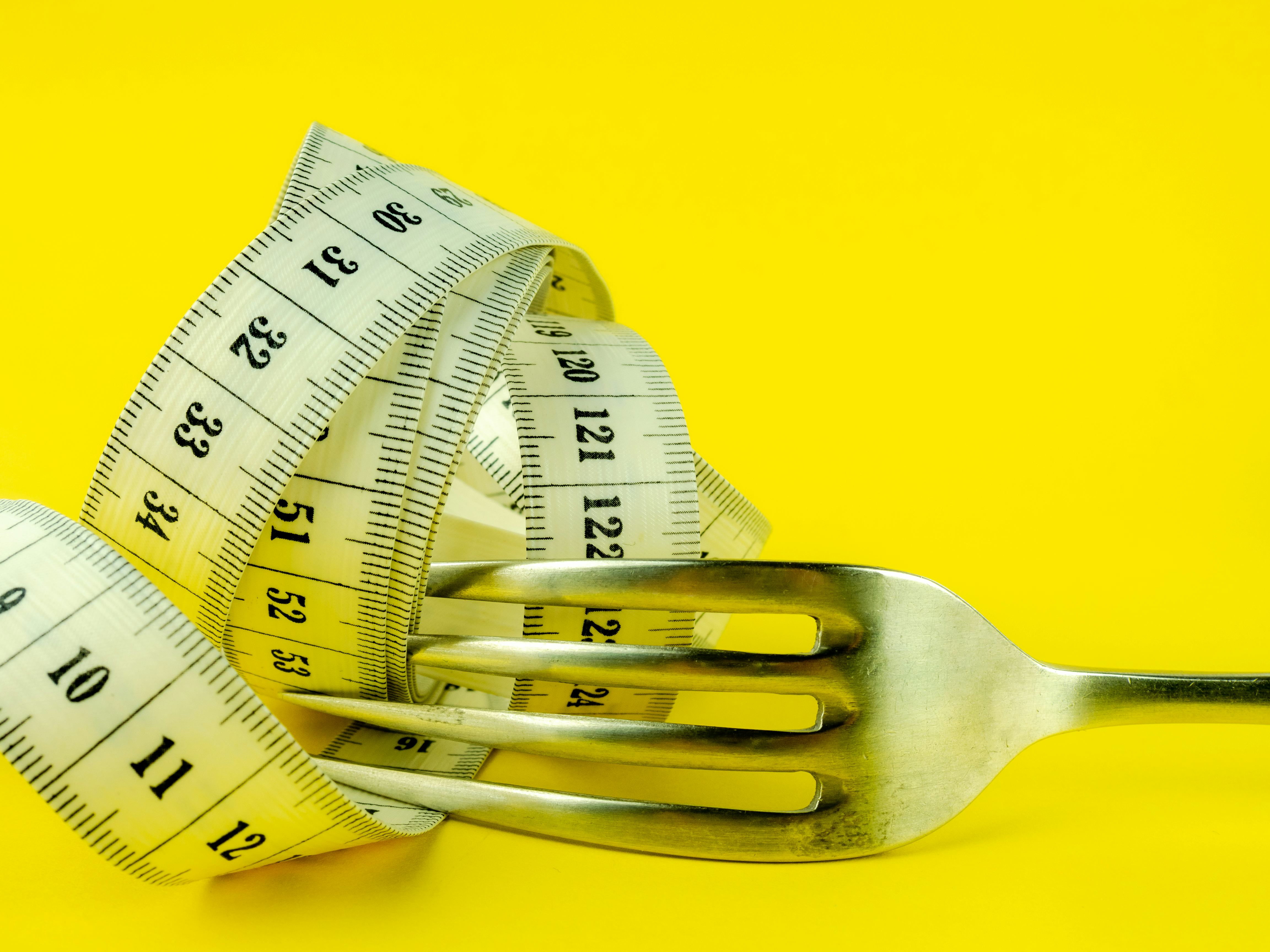 Studio shot against yellow background with negative space for text
