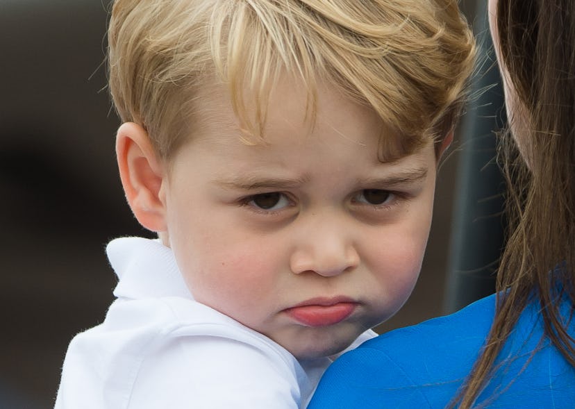 Prince George looks over it.