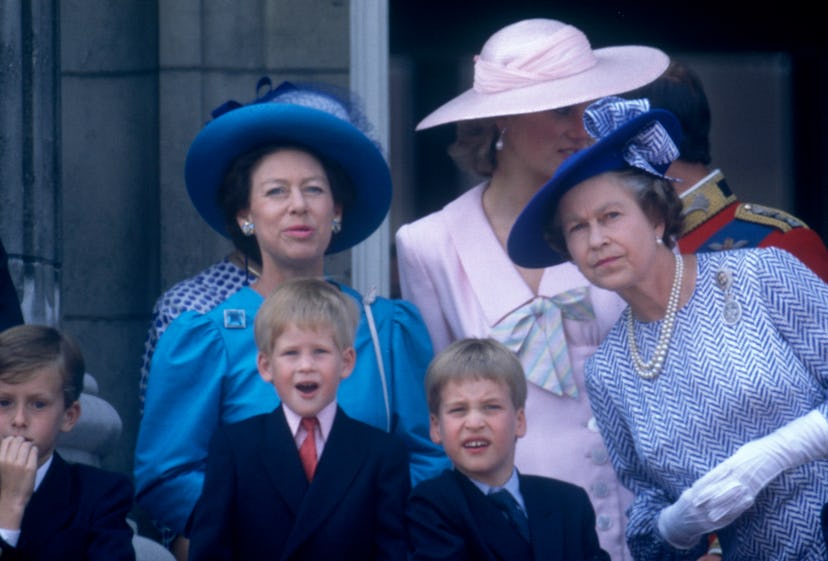 Queen Elizabeth leans in to talk to her grandsons.