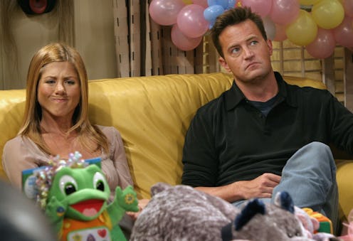 Jennifer Aniston and Matthew Perry in between takes on the set of "Friends" in 2003.