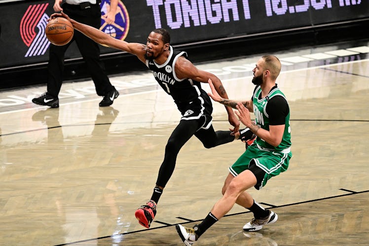 NEW YORK, NEW YORK - MAY 22:  Kevin Durant #7 of the Brooklyn Nets chases down a loose ball against ...