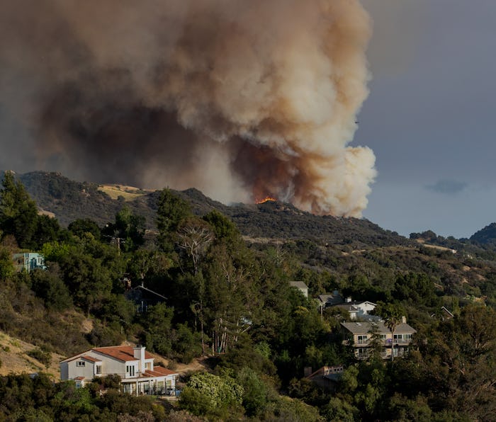 LOS ANGELES, CA - MAY 15, 2021: The Palisades wildfire burns out of control in rugged terrain near h...