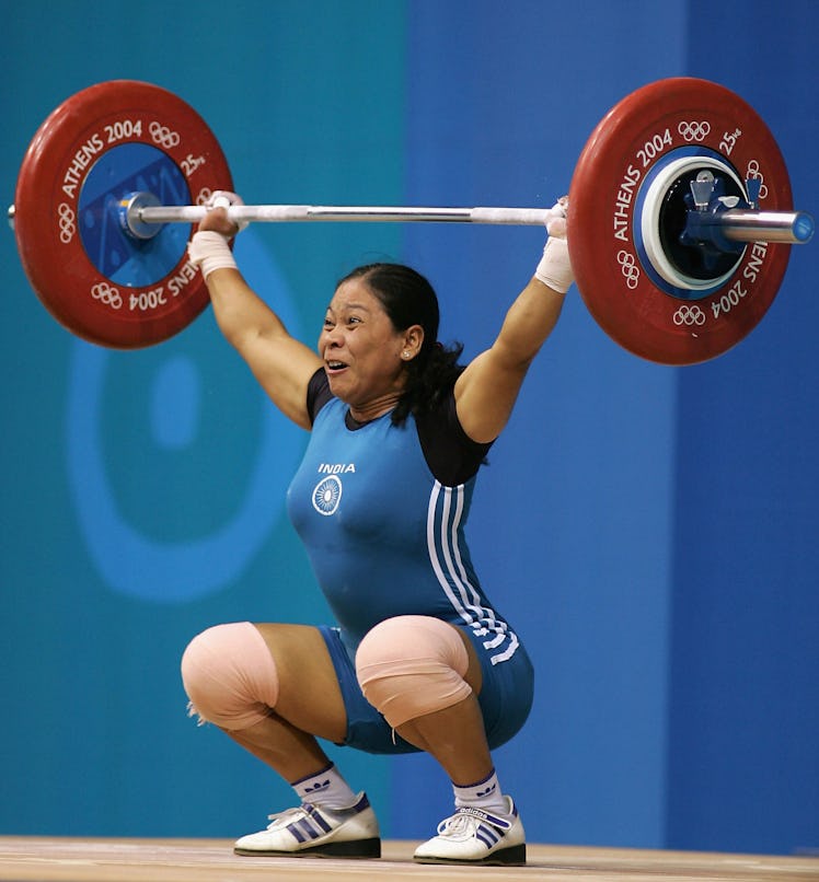 ATHENS - AUGUST 15:  Thingbaijam Sanamacha Chanu of India competes in the women's 53 kg category wei...