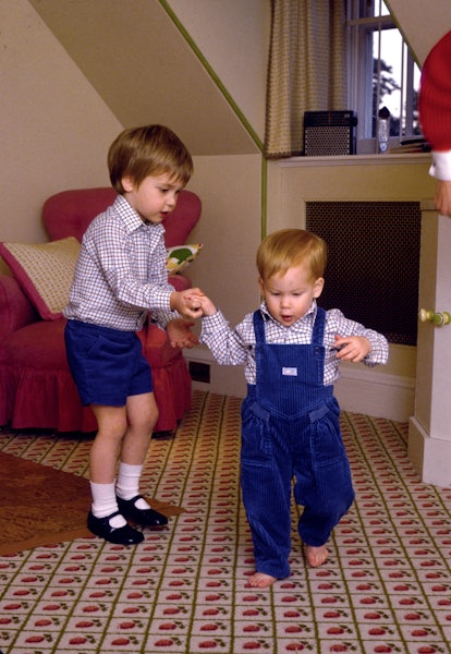 Prince William helps out his baby brother.