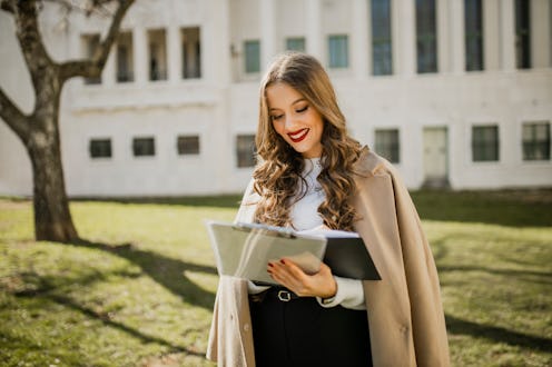 Businesswoman working in the park