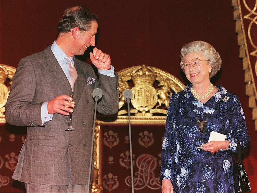 Prince Charles drinks champagne with his mom.