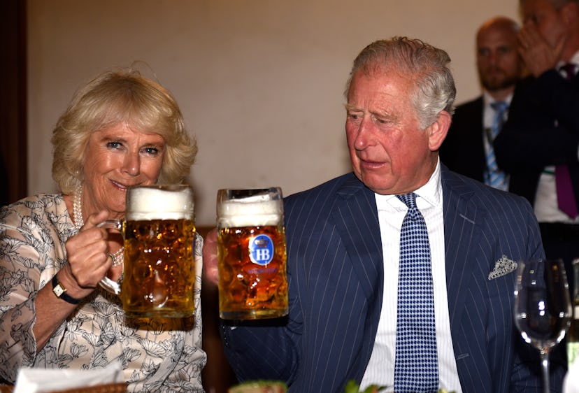 Camilla Parker Bowles and Prince Charles drink beer together.