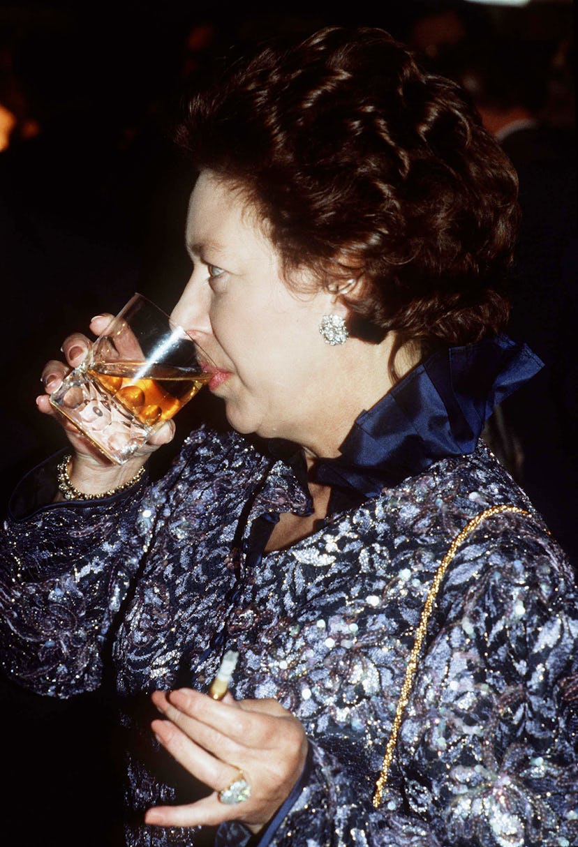 Princess Margaret enjoying a cocktail.